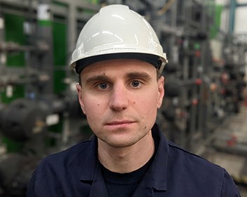 Caucasian male in a white hard hat