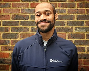 Smiling man in blue jacket